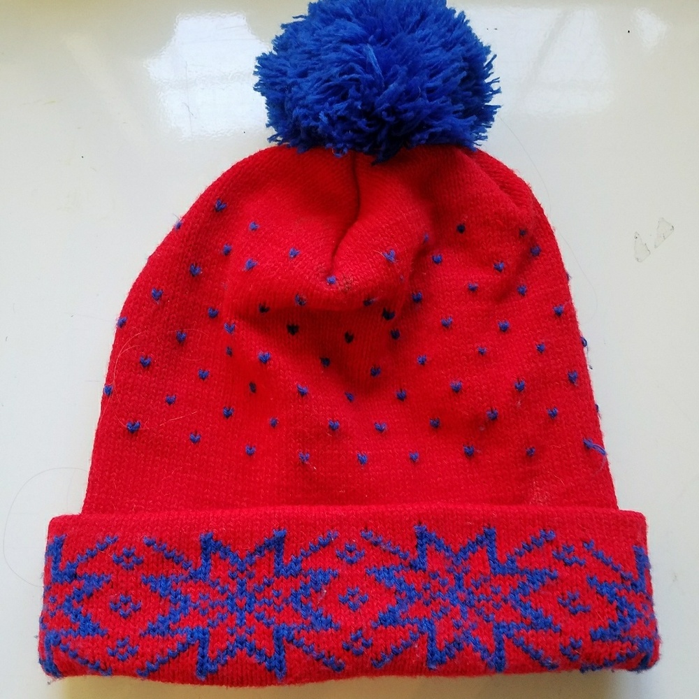 Red and blue pom pom beanie with snowflakes